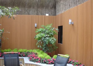 WPC wall panel installation in a backyard garden