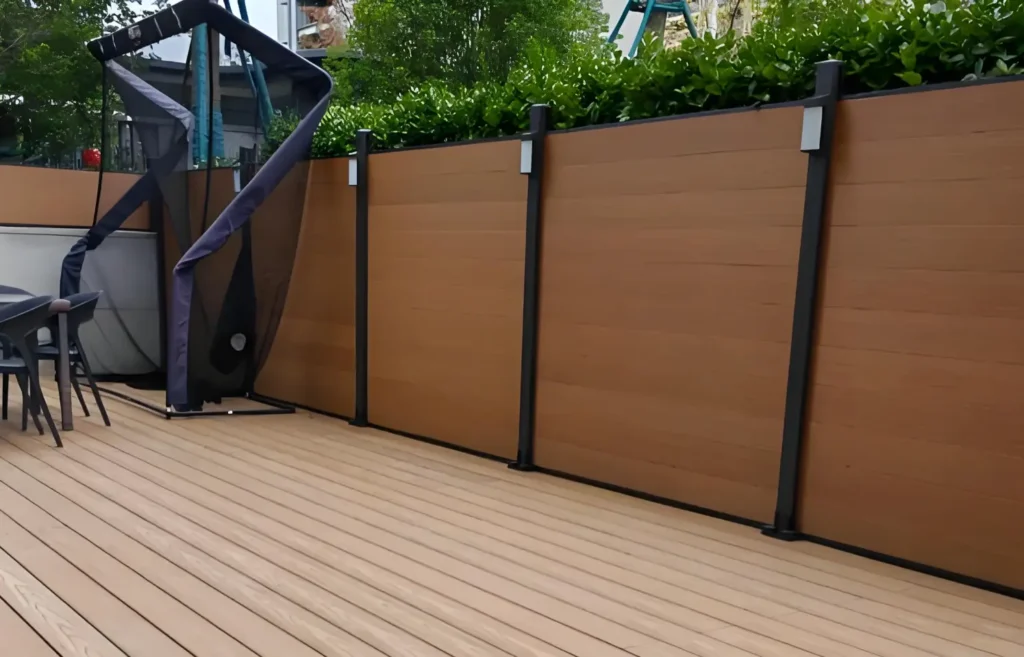 Installed WPC fence boards in a modern backyard garden